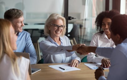 Senior nursing leader shaking hands with a colleague Senior nursing leader shaking hands with a colleague